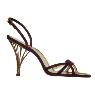 Salvatore Ferragamo, Calipso, 1955. Sandal in black satin. Cage heel in brass. Museo Salvatore Ferragamo, Florence. Courtesy of Sony Pictures Classics.